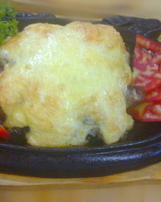 Свинина с грибами под сырной шапочкой